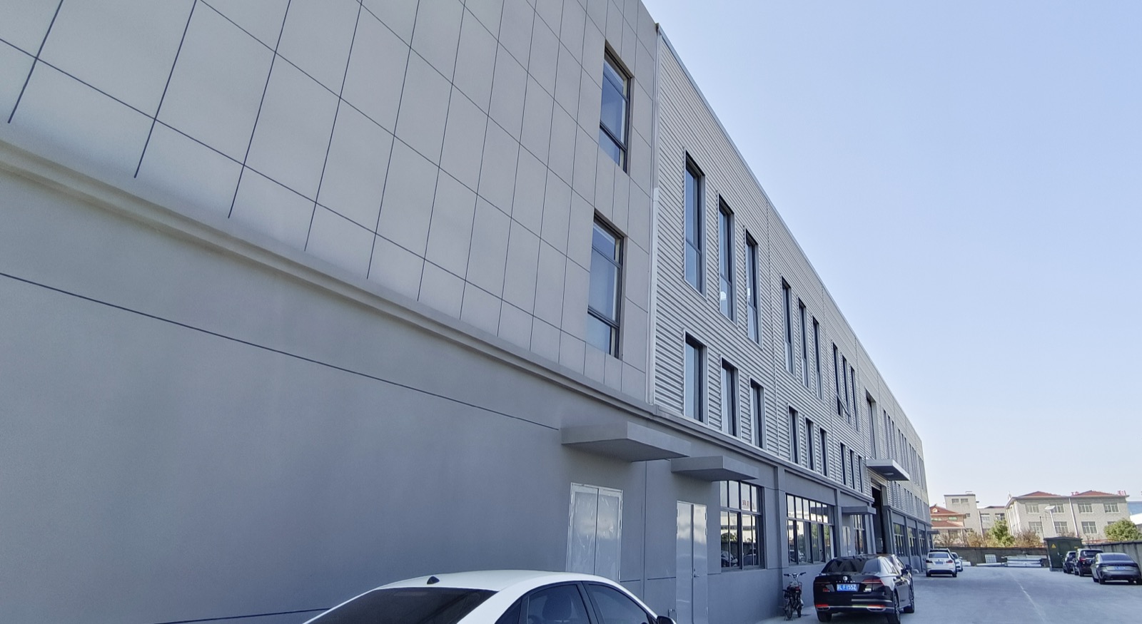 TAICLET factory gate with company name sign