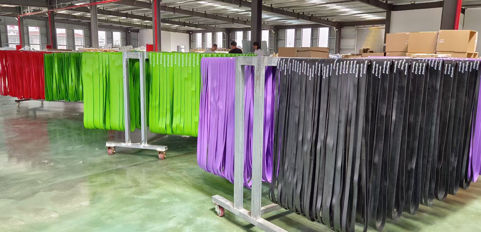 Production line workers assembling bands